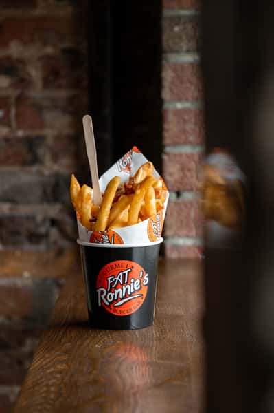 French fries served in a branded paper cup
