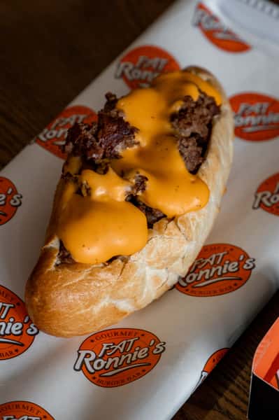 Loaded cheesy hot dog with grilled toppings