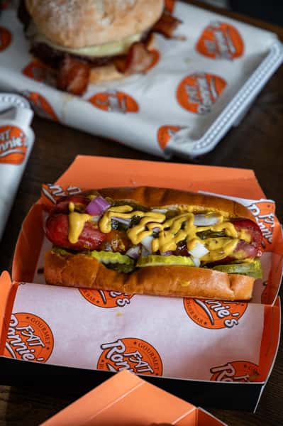 Loaded chili cheese hot dog in a serving tray