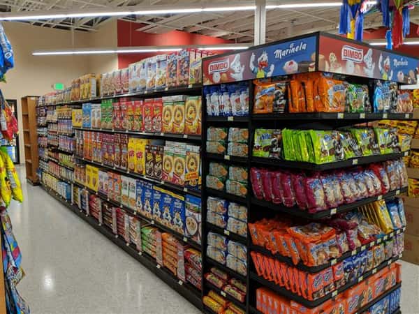 Market aisle with cereals, end cap with cookies and desserts