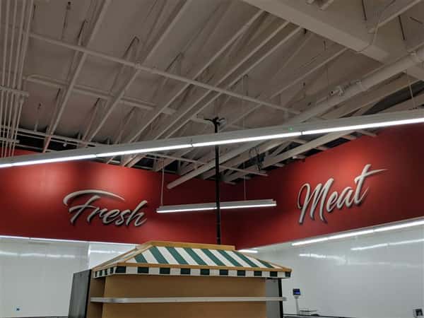 Fresh meat sign on wall inside market