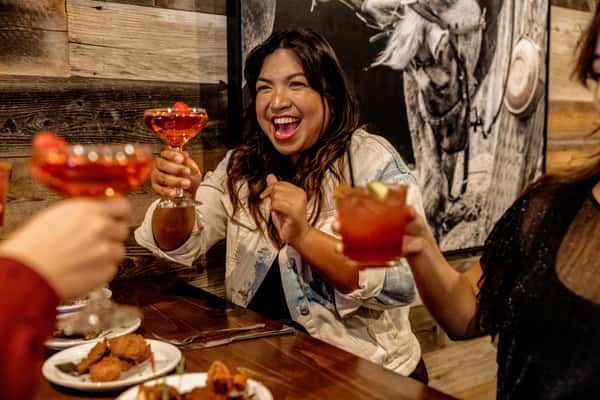 guests toasting with cocktails