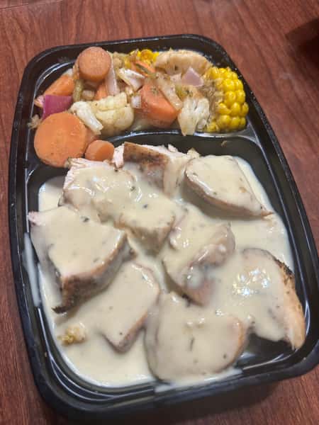 Smothered Chicken w/ gravy over rice