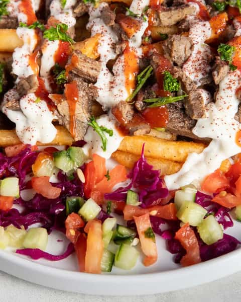 Crispy fries loaded with juicy chicken shawarma, fresh toppings, and signature sauces. This is how we do fries. 🔥
Dine with us and dig in!