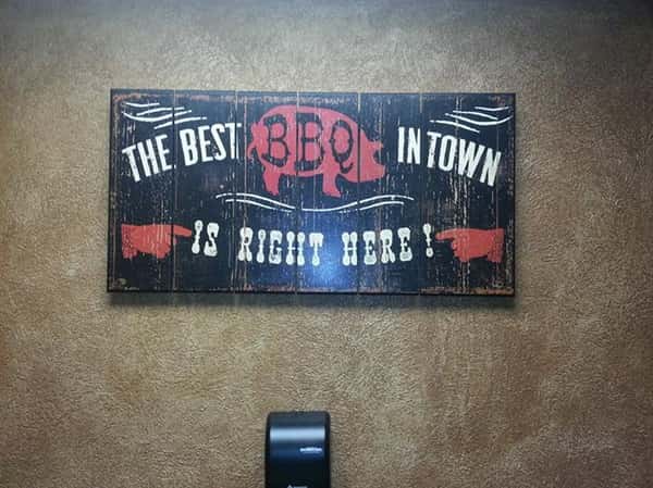 a sign that says "The Best BBQ in town is right here"