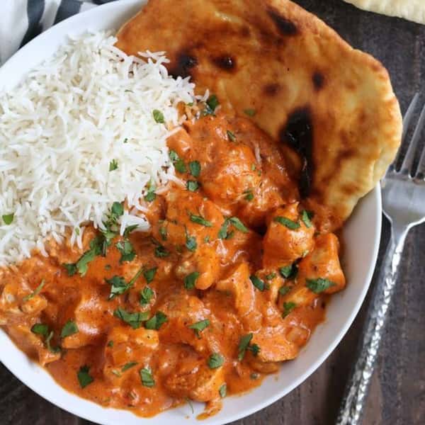 butter chicken with rice and a pita