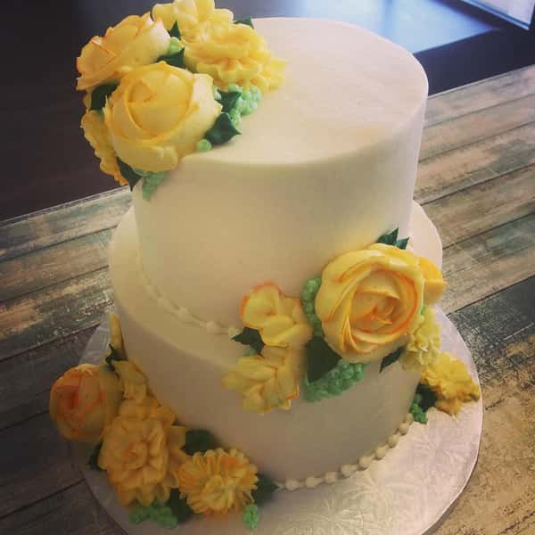 Wedding cake with yellow roses