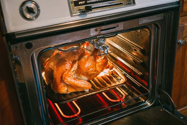 Roasted turkey in oven.