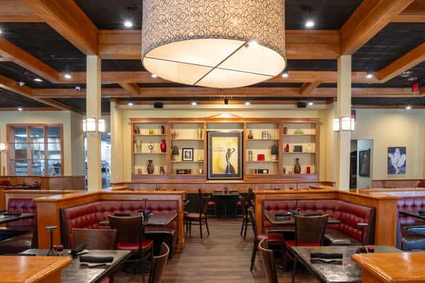 Interior dining room with tables, chairs and booth seating