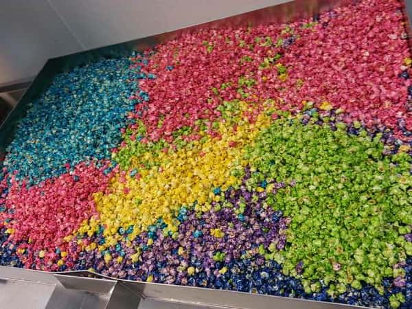 Multi-colored popcorn in large vat