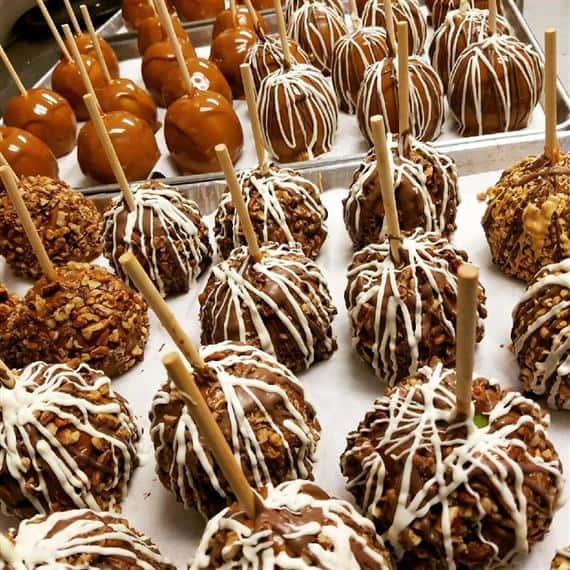 Caramel and candied apples on trays.