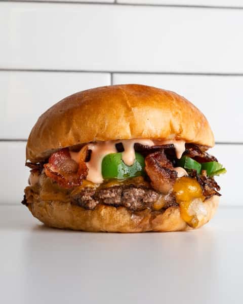 Bacon Jalapeño Burger (bacon, grilled jalapeno, grilled onions, cheddar cheese, burger sauce)