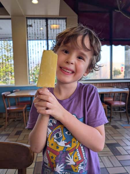 kid eating popsicle