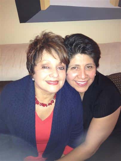 two females posing for picture