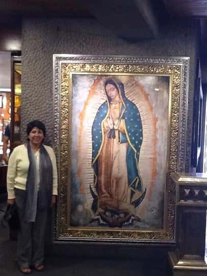 female posing next to a picture