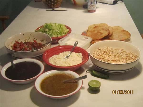several bowls of food on a table