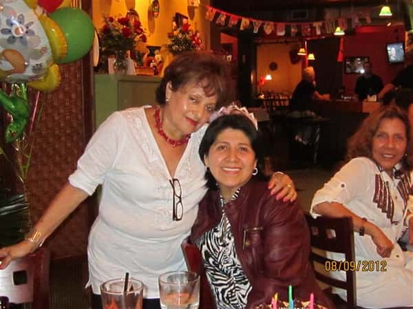 two females posing for picture