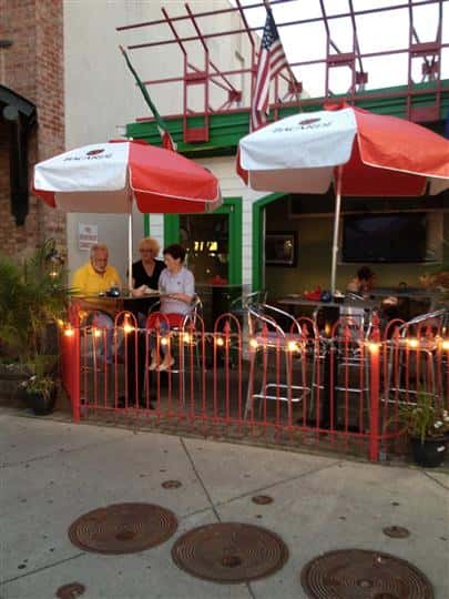 outside patio with umbrella above tables