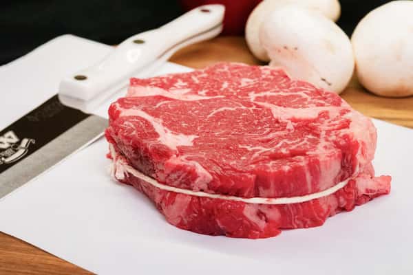 raw chuckeye steak with rich marbling displayed on butcher paper ready for cooking