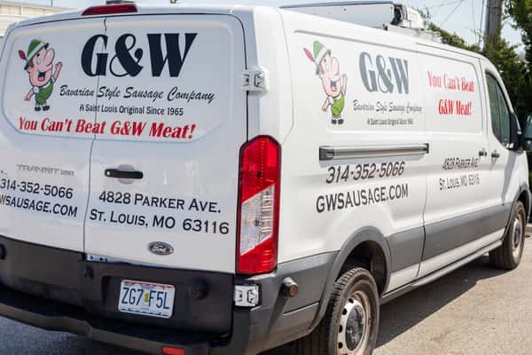 G&W Sausage Company delivery van with logo and contact information parked outside
