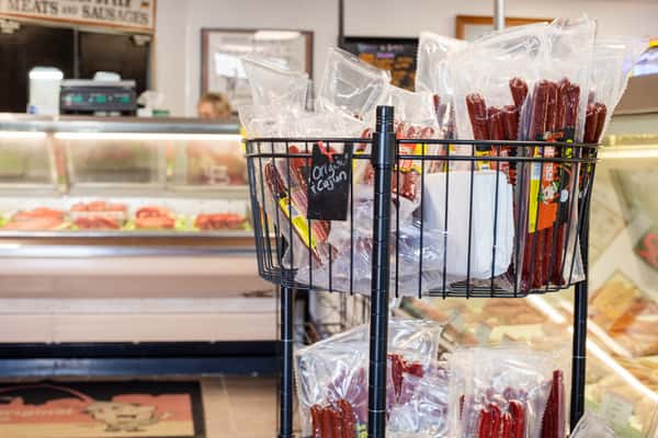 retail display rack with packaged sausages and snack items inside G&W Sandwiches