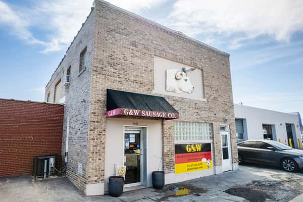 G&W Sandwiches storefront with brick facade and entrance under branded awning
