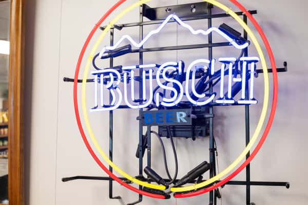 Busch beer neon sign glowing inside G&W Sandwiches dining and counter area