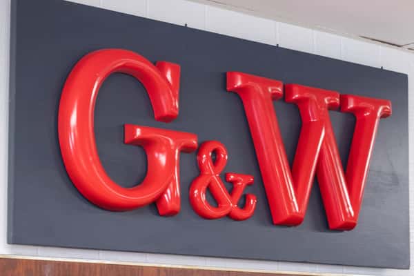 close-up of G&W logo sign mounted on interior wall of sandwich shop