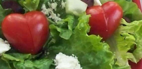 house salad with heart shaped tomatoes