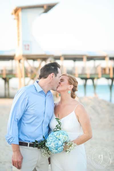 Newly wedded couple kissing