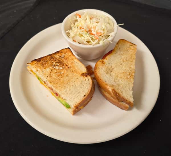 Sample photo of out Bacon Tomato Avocado Grilled Cheese with our home-made Cole Slaw