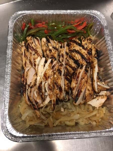 Grilled chicken, onions and peppers in a container