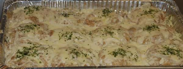 Dish in a container that contains alfredo