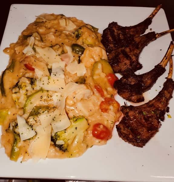 lambchops served with cheese vegetable risotto