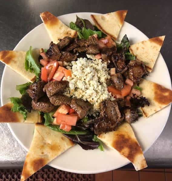 salad with steak and fresh blue cheese crumbles, served with fresh pita