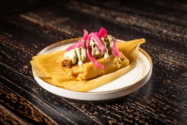 Cuban Tamale, roasted pork , pickle red onions