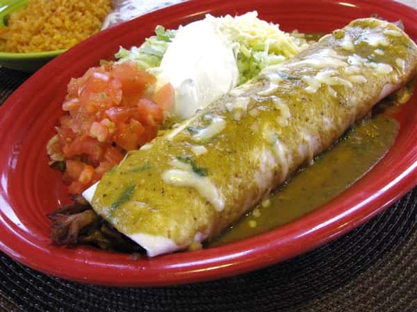Chimichanga with green sauce served with guacamole, pico de gallo and sour cream
