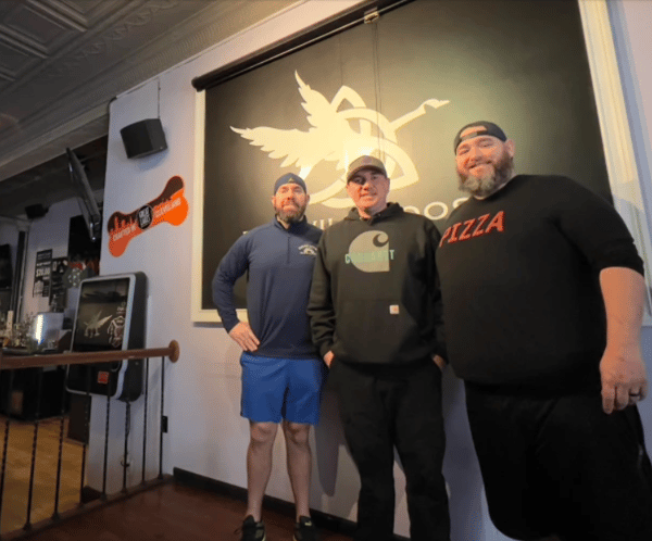 Brendan Kearney (far right) is a partner with McPat (far left) and Seamus (middle) Coyne, owners of The Wild Goose, Nora's Public House, Fiona's Coffee House and Mickey's Ice Cream in Downtown Willoughby.