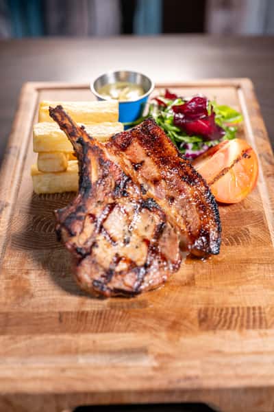 Gidi Grill Pork Belly with Chips on Wooden Board