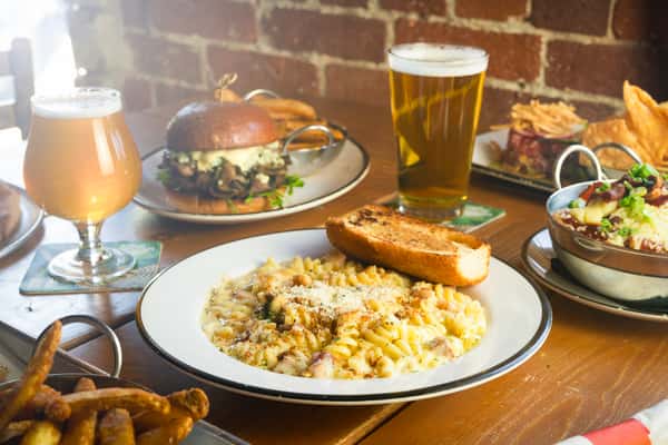 pork belly mac and cheese next to a Carson city burger and a pint of beer.