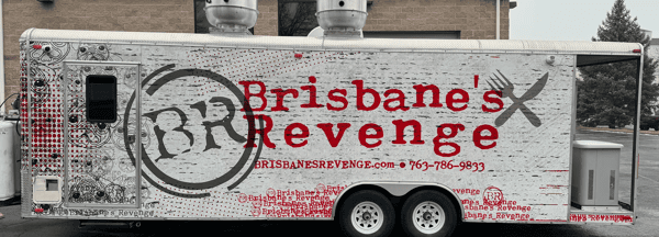Food truck labeled "Brisbane's Revenge" with bold red text, pug face illustrations, and crossed fork and knife graphics.