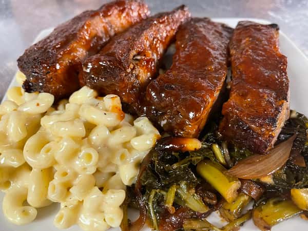 Peach BBQ ribs, white cheddar mac and cheese that's pure heaven, and collard greens