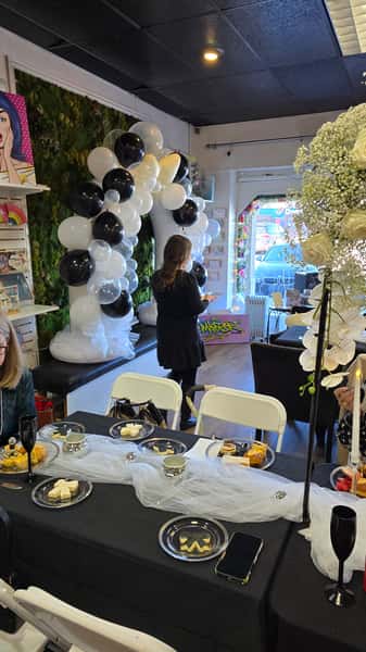 black and white balloon arch