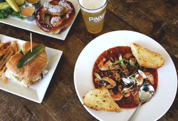 spread of menu items with pint of beer