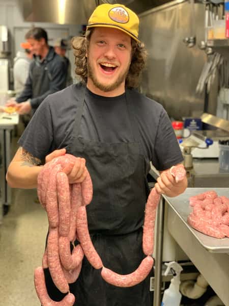 guy and sausages
