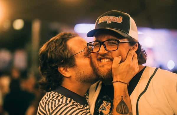person kissing other person's cheek