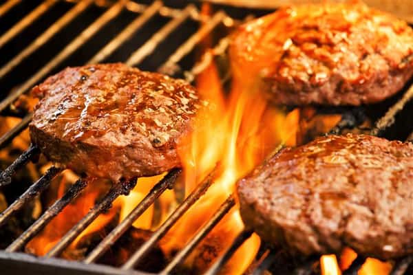 burgers cooking on grill