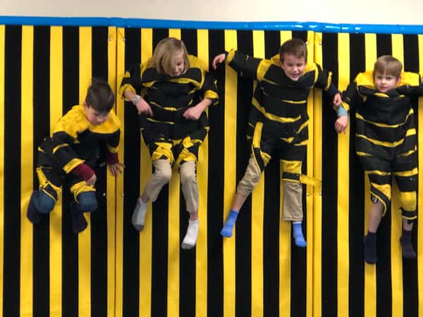 Kids attached to a sticky wall