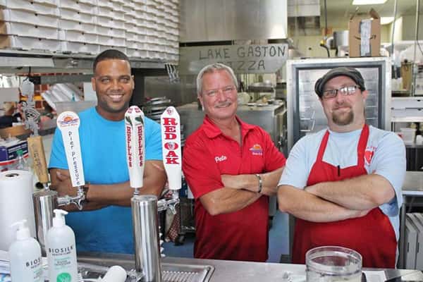 (From left) Kerry Huff, owner Pete Richardson and Jeremiah "Jam" Johnson comprise the brass of Lake Gaston Pizza & More. Huff, the general manager, and Johnson, the kitchen manager, are recent hires.