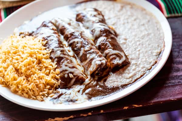 Served with rice and your choice of beans, your favorites sauce and filling.

Fillings: Beef | Spicy Chicken | Mushroom | Cheese

Sauces: Chili (Tex-Mex) | Verde (Tomatillo) | Chipotle (Smoked Jalapeno) | Ranchero (Tomato Veggie) | Mole (Family Recipe) | Sour Cream